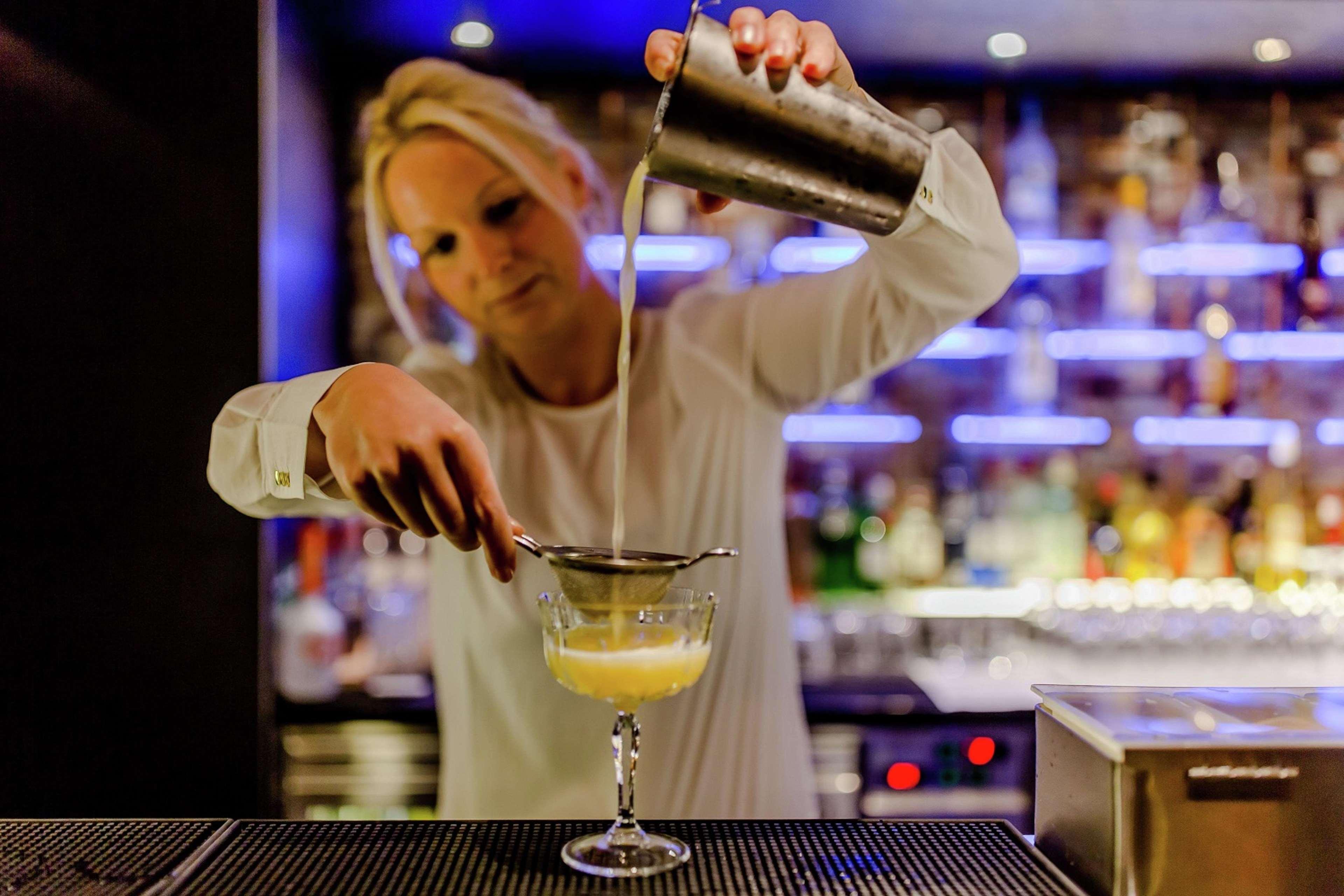 Hilton The Hague Hotel Exterior photo A bartender at work